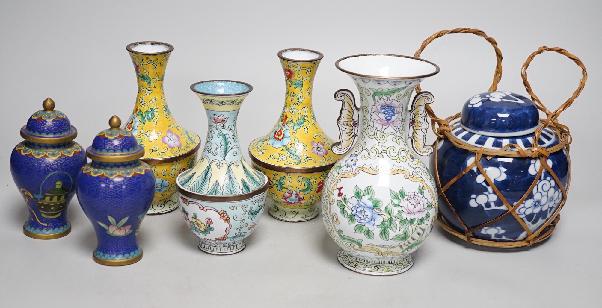 A group of Canton enamel vases, a pair of cloisonné enamel jars and a blue and white jar. Tallest 15.5cm